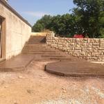 Stamped-concrete steps leading to pool and stamped pad for hot tub